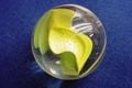 A yellow marble in the real world.